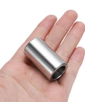 Hand holding a Stainless Steel Spacer 5/8 Bore 7/8 OD 1-1/2 Length, 304 stainless round metal standoff bushing plain finish.