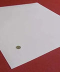 Virgin PTFE Sheet One Thirty Second Inch Thick Twenty Four By Twenty Four Inch Rolled for Convenience shown flat on surface