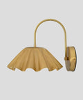 SHAHLUMES Handcrafted Curved Brass Flower Wall Sconce | Modern Bedside Wall Light | Sculptural Floral Brass Lamp in matte black finish.