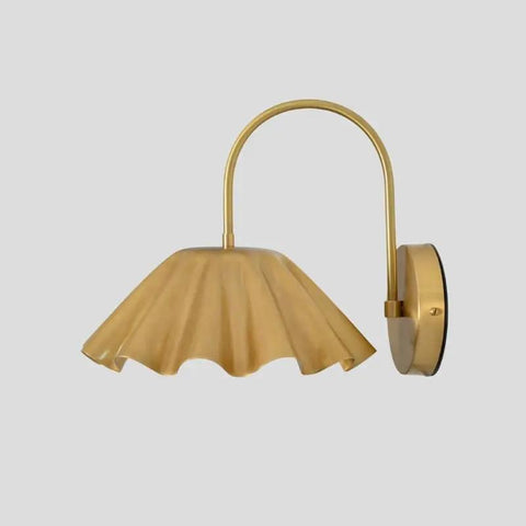 SHAHLUMES Handcrafted Curved Brass Flower Wall Sconce | Modern Bedside Wall Light | Sculptural Floral Brass Lamp in matte black finish.