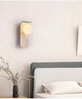 Cream LED Wall Sconce, 9 x 25 cm Modern Warm White Wall Lamp with Stone and Glass Design for Bedroom, Hallway, Hotel(Color:Cool White) mounted above bed.
