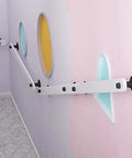 Rock Solid Pine Wood Stair Handrail Featuring Tight Non Slip Grip And Wall Mounted Safety Railing For Indoor Steps Built Tough For Seniors, white and black design on a colorful wall.