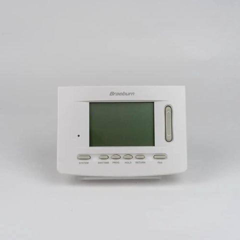 All In One Universal Wireless Thermostat For Residential And Commercial Hydronic Systems With 2 Or 3 Wire Connection 7 Day Or 5 2 Day Programmable Or Non Programmable Modes Auto Or Manual Changeover Battery Powered With 5 Sq In Backlit Display on gray backdrop