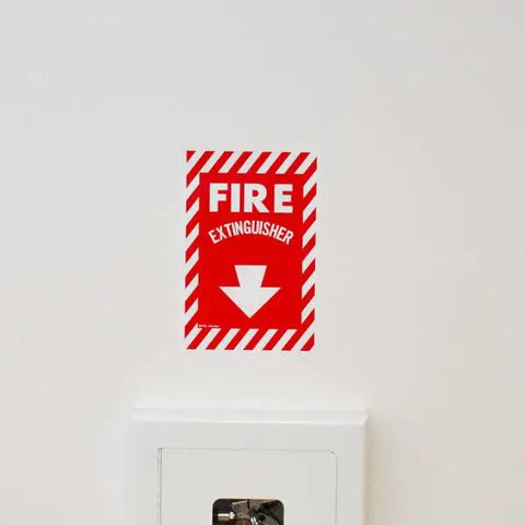 Fire extinguisher sign placed above a Tough As Nails Weather Resistant Fire Extinguisher Cabinet Lock Box For 20 Lb ABC Mount.