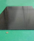UHMW PE Black Sheet 1/4 Inch Thick 24 By 36 Inches Built To Last Durable Wear Resistant Plastic Panel on green surface