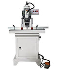 Front view of pneumatic hinge boring drill press for woodworking; white metal body with control panel.