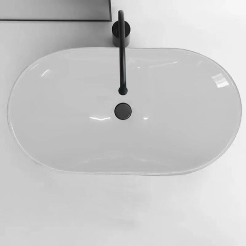 Top view of a sleek white Bathroom Sink Modern Minimalist Art Basin Hotel Bathroom Ceramic Above Counter Basin with black faucet.