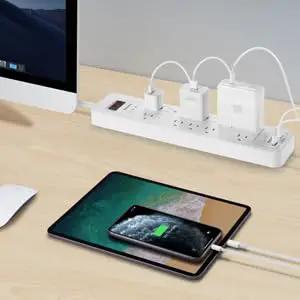 Boss Level Surge Protector Power Strip Featuring Hella Spacious 12 Outlets And 2 USB Ports Plus A Six Foot Extension Cord and devices in use