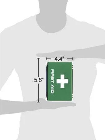 Front view: Homeopathic First Aid Kit, green box with white cross, held by hands; 4.4 by 5.6 in