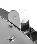 Stainless steel hinged bow anchor roller with white plastic roller on a boat bow, close-up view