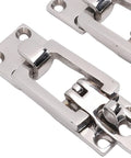 Close-up of two marine-grade 316 stainless steel lockable hatch latches with center tension cam and padlock holes