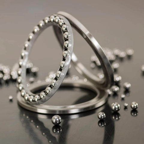 8mm Bearing Balls Set 100 Pcs 316 Stainless Steel G200 Precision Balls in bearings on a reflective surface