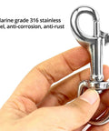 Close-up of a hand holding a 316 Stainless Steel Three And One Half Inch Swivel Eye Bolt Snap Hook, showing marine-grade finish.