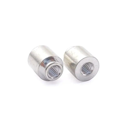 Legit M3 SMD Nuts With Solder Surface Mount Circuit Board Standoffs Heavy Duty Copper Through Hole Spacer Pins For PC Builds Kickass Durability Smooth Finish 100 Pack close-up of two copper spacer nuts.
