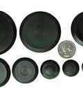 Assorted sizes of Fifty Piece Flush Mount Plastic Hole Plug Set For Auto Body And Sheet Metal displayed on a white background with a coin for scale.