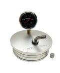 Front view of a 4-inch aluminum boost leak tester end cap with 15 PSI gauge and T-bolt clamp