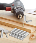Durable 316L Stainless Steel Dowel Pins Set, 4 Pcs, 16mm Diameter By 30mm Length next to drill and wood on table