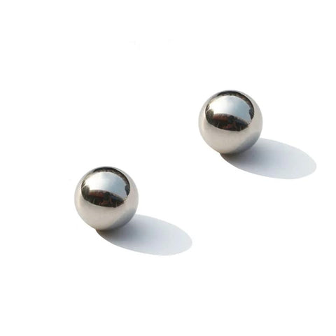 Close-up of two 0.3mm 316L stainless steel balls from 100Pcs 0.3mm Solid 316L Stainless Steel Ball - Smooth Beads Round Balls set