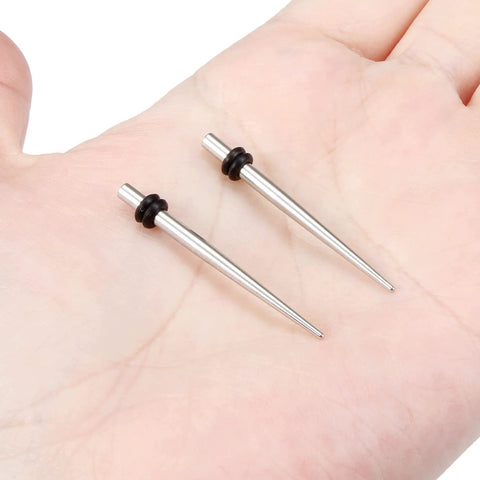 10G Ear Gauges Stretching Kit With 316L Surgical Steel Tapers And Insertion Pins on a hand