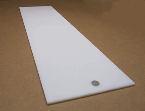 Tough As Nails White UHMW Polyethylene Sheet Five Sixteenth Inch Thick Twelve By Forty Eight Inches Standard Heavy Duty Low Friction Wear Resistant Material Meets ASTM D 4020 05, side view on brown surface.