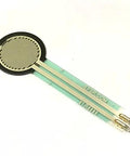 FSR402 force sensing resistor on green flexible PCB with round sensing pad and two gold leads