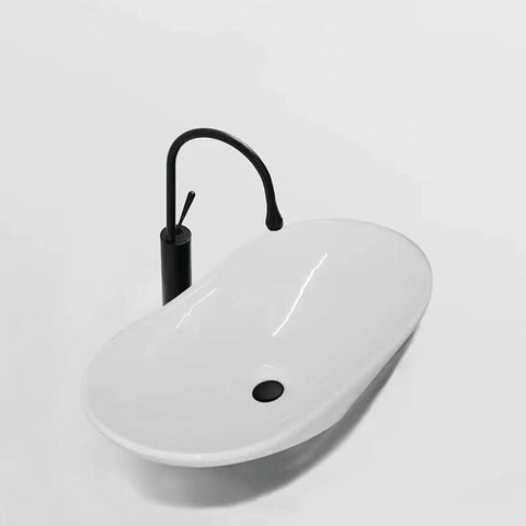 Bathroom Sink Modern Minimalist Art Basin Hotel Bathroom Ceramic Above Counter Basin with black faucet and smooth curves.