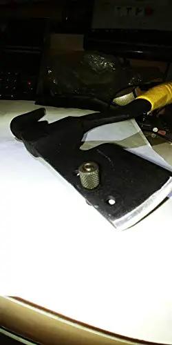 Heavy Duty Magnetic Roofing Hatchet Hammer With Killer Magnet And Rock Solid All Steel Build Perfect For Pros Slapping Shingles And Yanking Nails With Ease on a table.