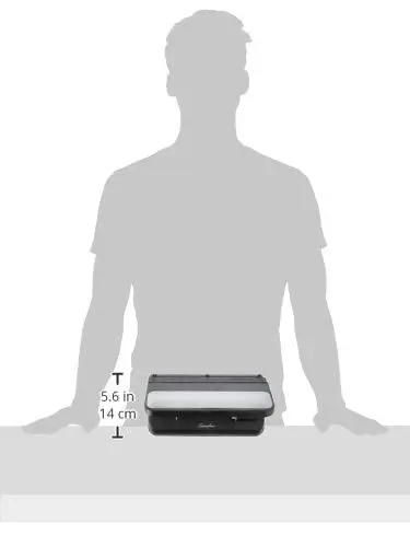 Heavy Duty 2 To 7 Hole Punch With Adjustable Head And Easy Touch Handle 32 Sheet Capacity next to silhouette for size comparison.