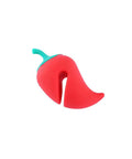 Red silicone pot lid holder in chili shape, designed for zero spill cooking, aiding heat management during simmering.