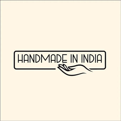 Logo featuring the text 'Handmade in India' with a stylized hand illustration on a beige background.