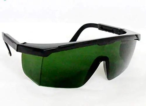 Rock Solid Industrial Laser Safety Eyewear Blocking Piercing UV And Infrared Light With Heavy Duty Optical Density Shielding Built For 266Nm Nd Yag And 1064Nm Job Site Gear, side view showing green tinted lenses.