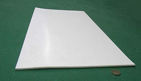 Sheet Three Sixteenth Inch Thick By Twelve By Twenty Four Inches Of PTFE for nonstick surfaces on green background