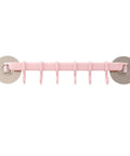Self Adhesive Bathroom Towel Ring Holder With Rock Solid Grip Pad For Hassle Free Wall Mount Kitchen Storage Rack Stainless Steel Look with six hooks on a pink bar.