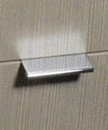 2 Inch Edge Pull in Polished Chrome for cabinets and drawers installed on wood surface, showcasing modern sleek hardware and durable finish.