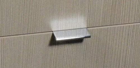 2 Inch Edge Pull in Polished Chrome for cabinets and drawers installed on wood surface, showcasing modern sleek hardware and durable finish.