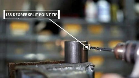 Drill bit close-up showing 135-degree split-point tip on high-speed steel bit in a vise.
