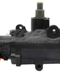Remanufactured Power Steering Gear Assembly With Built In Electrical Resistor Restores Precise Truck Handling And Kicks Out Wheel Wander Keeps Your Everyday Ride Solid As A Rock And Ready To Crush The Highway 5010116 side view of black steering gear.