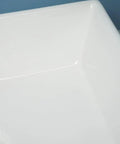 Close-up view of the USZWBY Vessel Sinks Modern Minimalist Home Balcony Ceramic Wash Basin with flat bottom.