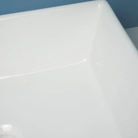 Close-up view of the USZWBY Vessel Sinks Modern Minimalist Home Balcony Ceramic Wash Basin with flat bottom.