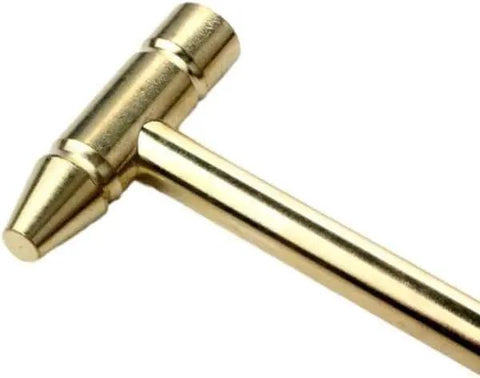 Close-up of brass hammer from Compact 6-In-1 Precision Mini Multi-Tool for watch repair and electronics.