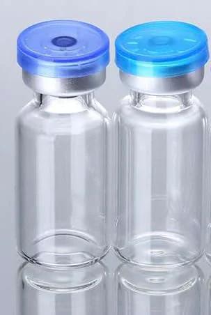 Two 10ml borosilicate glass lab vials with blue flip-off caps, front view