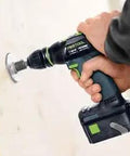 A hand holding the Professional 18V Cordless Drill And Driver Tool With Quick Change Chuck System drilling into wood.