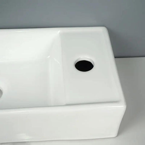 Top view of USZWBY Vessel Sinks Ceramic Vessel Sink Modern Minimalist Wall-Mounted Washbasin with faucet hole.