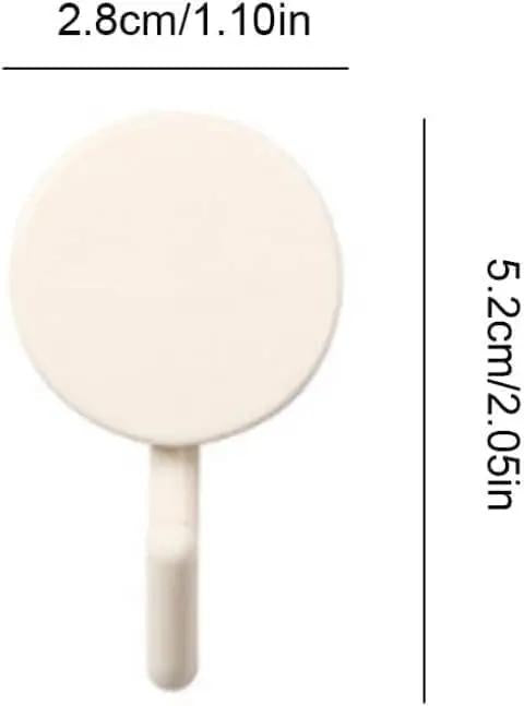 Close-up of a round creamy white peel and stick wall hook, dimensions 2.8cm x 5.2cm, for decorative bathroom organization.