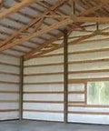 Interior view of a metal building with Top Shelf 2 Inch Fiberglass Insulation Roll With Psk Facing for thermal shielding.
