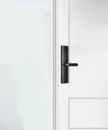 Game Changing Smart Door Lock With Smooth Fingerprint Recognition Password Keyless Entry Remote Control Auto Locking and Anti Spoof Technology mounted on a white door.