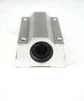 SCS13LUU 13mm Linear Slide Unit Includes Ball Bearings For Dead Smooth Cnc Operation And Rock Solid Stability With A High Quality Bushing Block Ready To Drop In front view of steel bearing block.