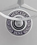 Top view of Mercedes Hood Ornament Chrome Emblem For 2003 2004 2005 C230 Sedan OEM 2108800186 with laurel wreath design