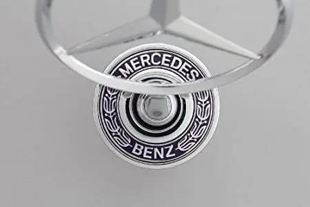 Top view of Mercedes Hood Ornament Chrome Emblem For 2003 2004 2005 C230 Sedan OEM 2108800186 with laurel wreath design
