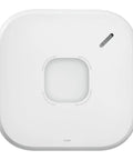 Slick Hardwire Smart Smoke And Carbon Monoxide Detector With Instant Phone Alerts Seamless Interconnection Reliable Battery Backup For Quick Setup And Rock Solid Home Safety Security, top view showing sensor and test button.